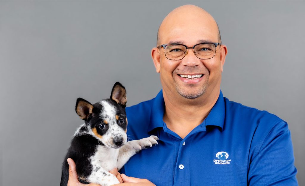 Ed Jamison holding a puppy