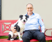 Eric with a black and white dog.