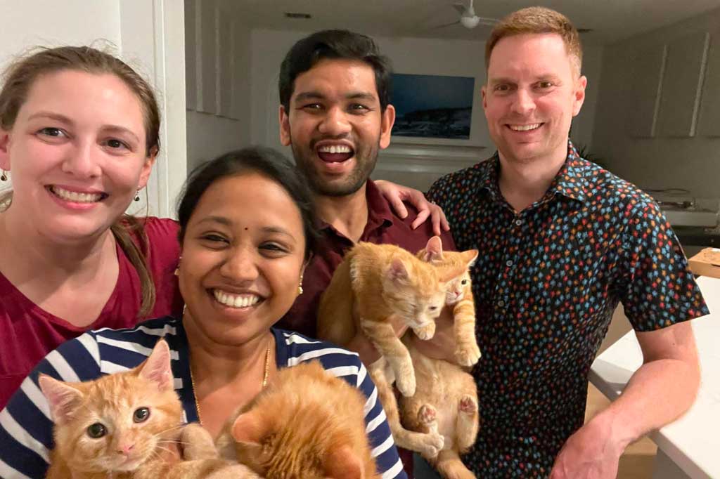 Volunteer foster family with kittens from Operation Kindness